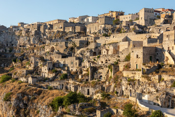Obraz premium View of the Sassi di Matera a historic district in the city of Matera, well-known for their ancient cave dwellings. Basilicata. Italy