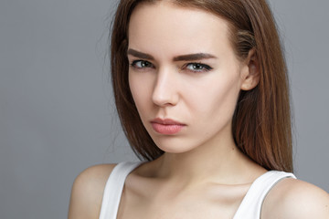 Fototapeta premium Girl angry, tense looking at camera.