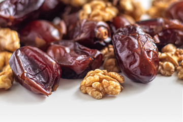 Brown dried dates and peeled walnuts