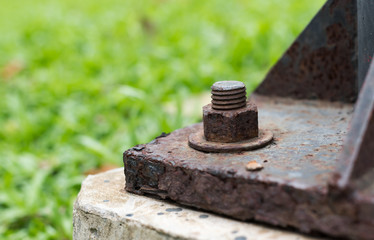 Rusted lighting post steel base plate,  Rusted screw