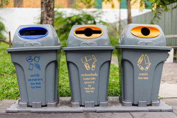 Many trash bins in the park.