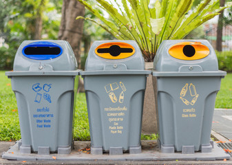 Many trash bins in the park.