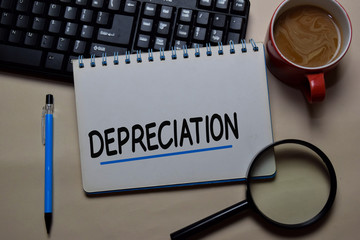 Depreciation write on a book isolated on office desk.