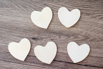 Wooden hearts on a wooden background