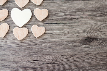 Wooden hearts on a wooden background