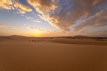 Plakat Sand dunes in the National Park of Dunas de Corralejo during a beautiful sunset, Canary Islands - Fuerteventura