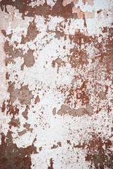 Old cemented shabby wall with white and red paint. Wallpaper of the old wall.