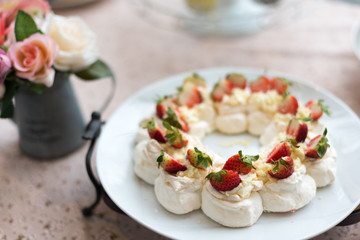Pavlova meringue cake dessert with strawberries.