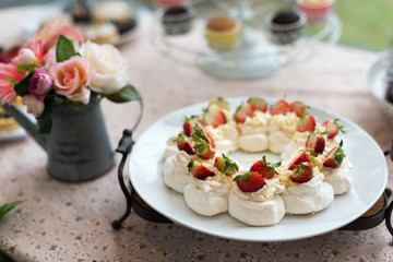Pavlova meringue cake dessert with strawberries.