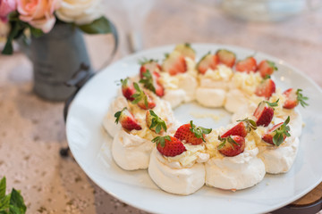 Pavlova meringue cake dessert with strawberries.