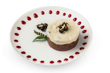 a piece of pancake cake with a cap of berries doused with white chocolate on a plate with Belgian muffins on a white table