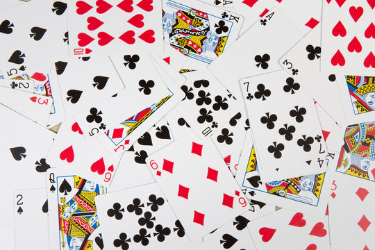 Background of scattered French playing cards face-up
