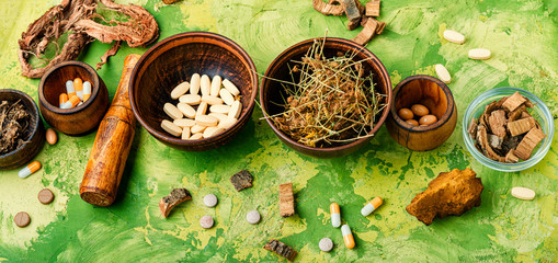 Fototapeta na wymiar Medical pills with healing herbs