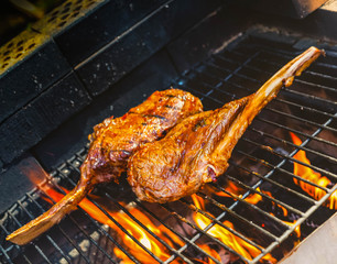 Tomahawk rib beef steak on briks homemade garden hot grill with flames