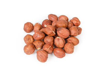 Top view of pile of peeled hazelnuts on white background