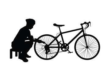 Obraz premium Young man with bike silhouette