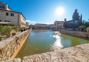 Fototapeta na wymiar Bagno Vignoni (Italy) - A view of the famous thermal waters village in Val d'Orcia, Tuscany region province of Siena, beside Via Francigena religious street