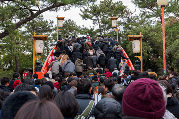 Crowd of people in front of the main entrance to Sumiyoshi Taisha Shrine during New Year vacation.
