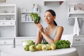 Healthy eating. Dieting and people concept. Brunette with a vegetable.