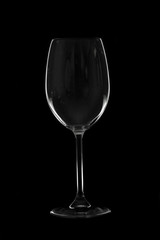 Empty tall wine glasses on black  background, isolated