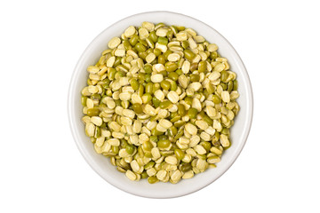top view of split moong in white bowl isolated on white background