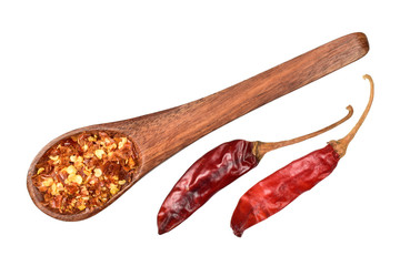 top view of chilli flakes in wooden spoon with dry red chillies isolated on white background