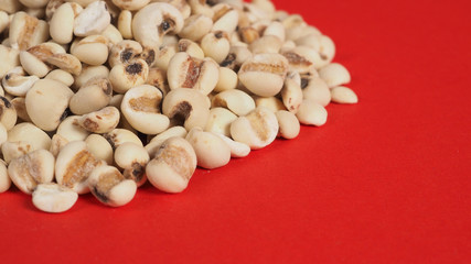 Job's Tears, also known as adlay and coix on red background. Popular in Asian cultures as a food source.