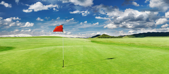 Golf field with a red flag - 318519522