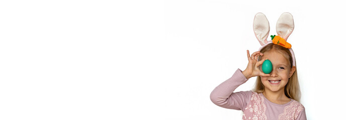 Cute little girl with bunny ears holding Easter egg, isolated on white background. Adorable child celebrate Easter holiday. Web banner with copy space, mock up, template