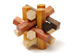 wooden puzzle over white background