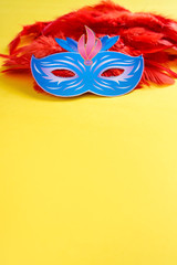 Carnival mask on yellow background 
