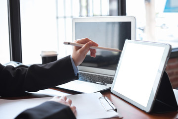 Business woman hand working with tablet in office.