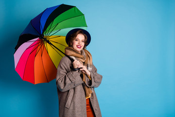Rain will not stop me. Photo of pretty traveler lady hold colorful parasol walking down street wear...