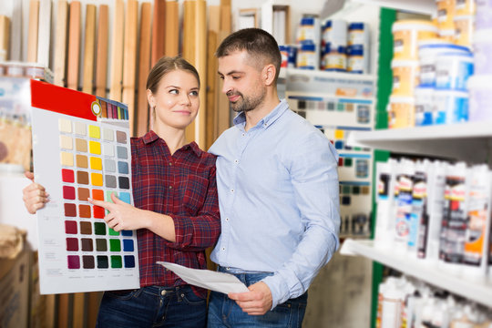 Two designer are looking sample of materials for repair