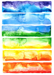 Watercolor strokes painted by hand. Rainbow colors. Abstract isolated on white background. Mix overflow yellow, blue, purple, orange, red, green color.