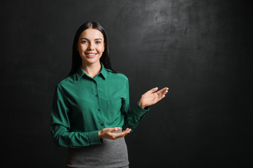 Female teacher near blackboard in classroom © Pixel-Shot