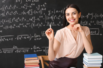 Female teacher at workplace in classroom