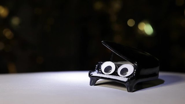 black piano flashlight gold bokeh hd footage 