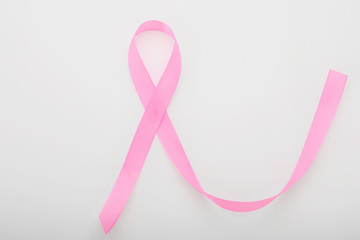 Pink ribbon on white background. Breast cancer awareness concept