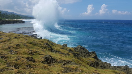 best paradise to see and enjoy the pounding waves crashing against the reef at batu picah beach biak papua indonesia