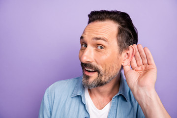 Omg you say promo. Amazed funky man hear wonderful sale discounts information hold hand ears feel content emotion wear stylish clothing isolated over violet color background