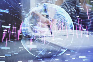 Fototapeta na wymiar Financial forex graph drawn over hands taking notes background. Concept of research. Double exposure