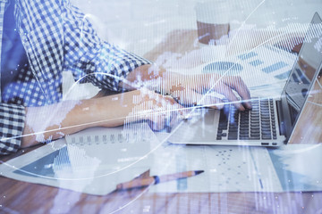 Multi exposure of stock market chart with man working on computer on background. Concept of financial analysis.