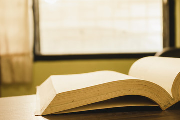 Close-up of books that were opened in an old atmosphere