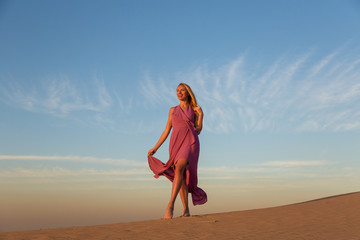 Blonde model in the desert at Emirates
