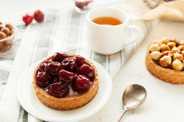 Tartlet with cherry. Cherry. Gourmet dessert.