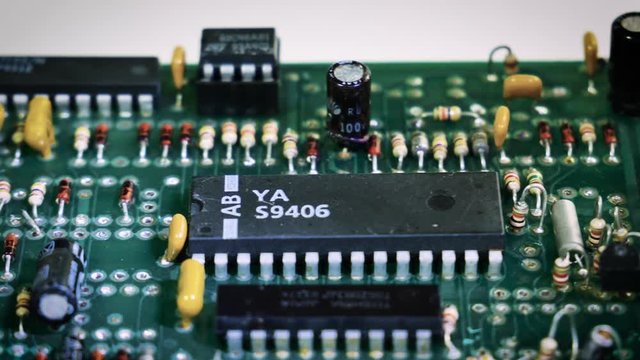 Close-up sliding video of a vintage printed circuit board - ic, resistor,capacitor. 4k