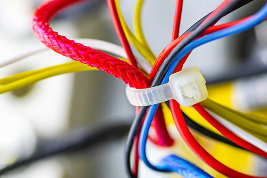 Multicolored electrical cables isolated close-up. Selective focus.