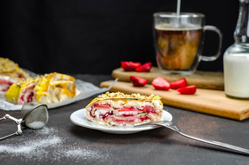Sugar free homemade strawberry cheese roll, healthy food, proper nutrition dessert with fruit. Coffee with milk and pastry for breakfast