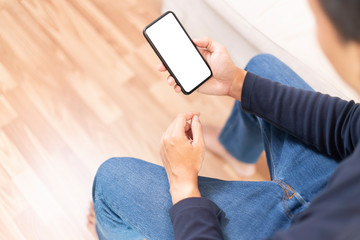 Man wear blue T-shirt Hands using smartphone blank screen for smartphone application